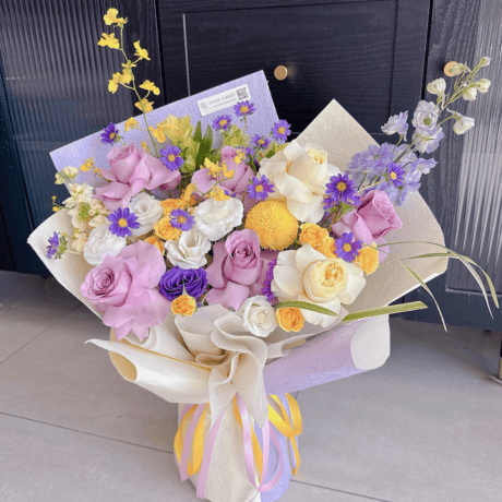 Yellow and purple mixed flower bouquet birthday gift Seven Florist